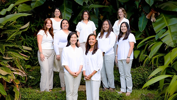 Dentist Aiea HI Angela Su And Arleen Regala With Team Posing In The Trees HP Angela Su And Arleen Regala With Team Posing In The Trees
